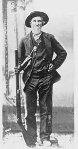 Unidentified historic mountain pioneer holding a rifle