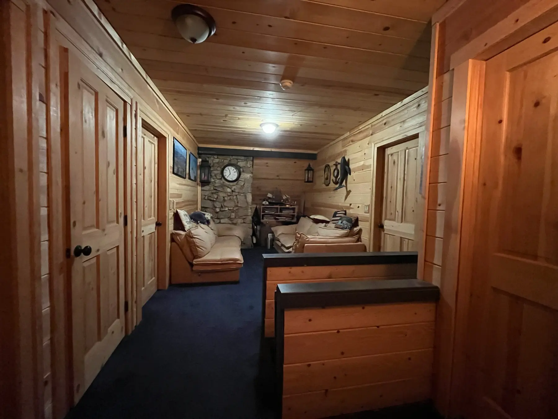 Wood-paneled hall and sitting area